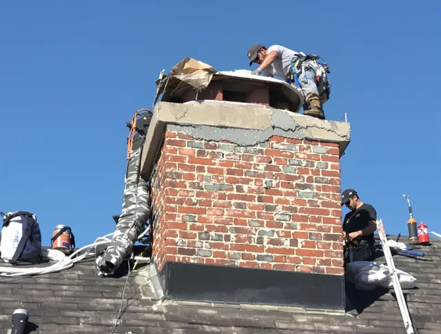 San Dimas Chimney Sweep installing a custom chimney crown in San Dimas, CA