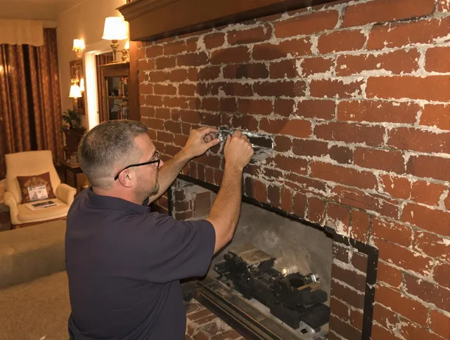 San Dimas Chimney Sweep expert fixing a fireplace in San Dimas, CA